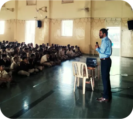 Trainer conducting an interactive digital safety workshop with school children